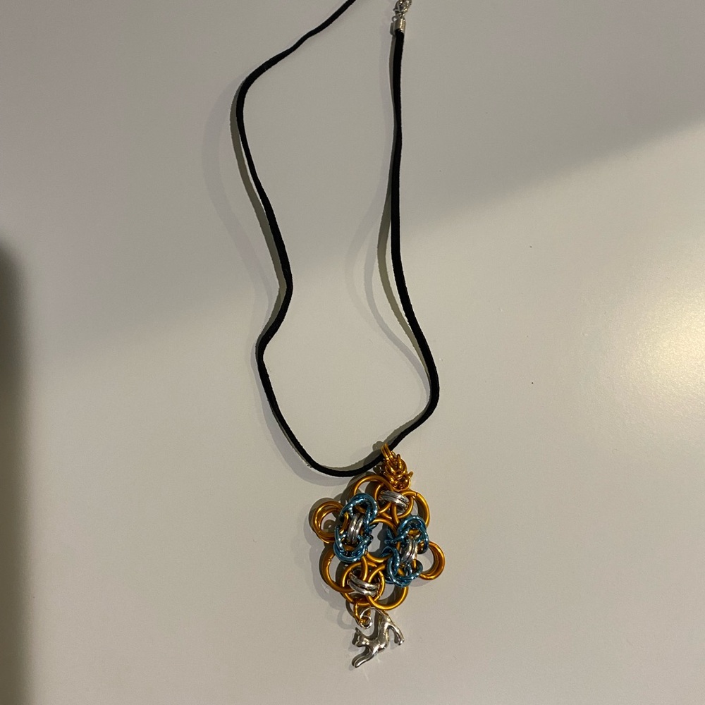 Elegant Gold tone and Blue Pendant artisan Necklace. Woman owned business